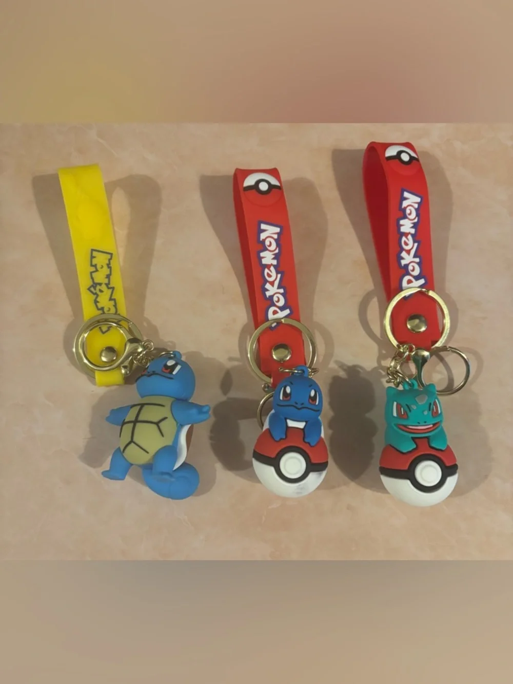 $5ea - Your Pick - Pokemon Squirtle Keychain with Red Strap and Blue Charm